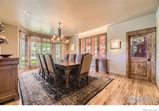 8576 Niwot Meadow Farm Rd, Niwot, CO 80503 - dining room with a chandelier and light wood-type flooring