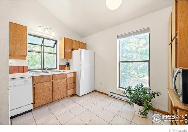 4717 Tantra Dr Unit G, Boulder, CO 80305 - kitchen with white appliances, light countertops, vaulted ceiling, baseboard heating, and light tile patterned flooring