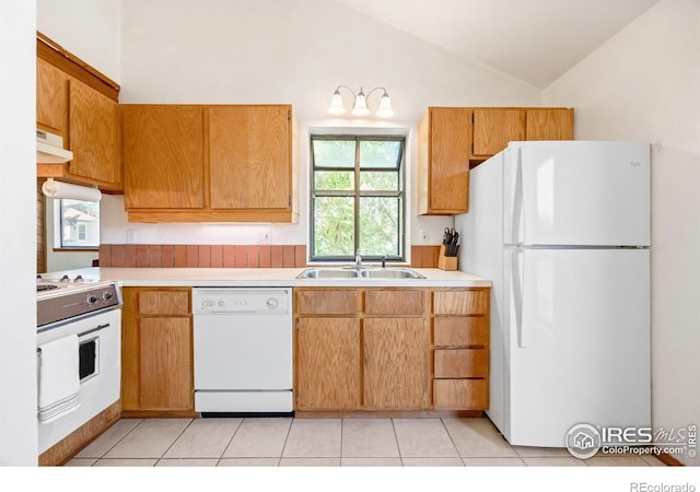 4717 Tantra Dr Unit G, Boulder, CO 80305 - kitchen featuring white appliances, vaulted ceiling, light countertops, light tile patterned flooring, and under cabinet range hood