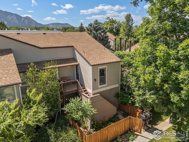 4717 Tantra Dr Unit G, Boulder, CO 80305 - view of front of home with a shingled roof, a mountain view, and stairs