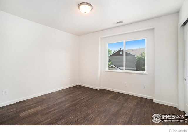 702 Cairnes Dr Unit B4, Fort Collins, CO 80524 - unfurnished room featuring dark wood finished floors and baseboards