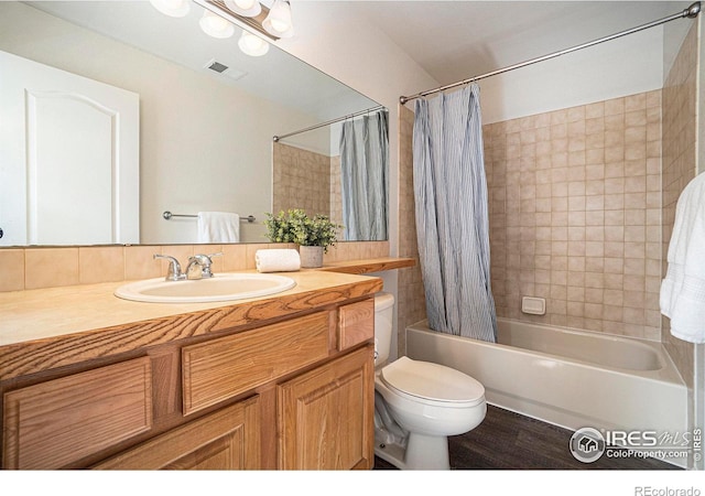 702 Cairnes Dr Unit B4, Fort Collins, CO 80524 - full bathroom with vanity, shower / bath combo with shower curtain, and wood finished floors