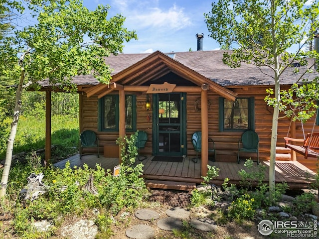 84 County Road 113 S, Allenspark, CO 80510 - rear view of house with roof with shingles and a deck