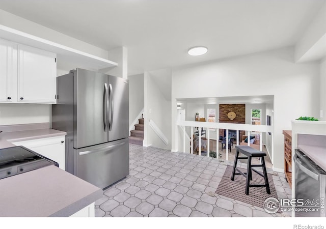 2036 Lexington Ct, Fort Collins, CO 80526 - kitchen with appliances with stainless steel finishes, white cabinets, and light countertops