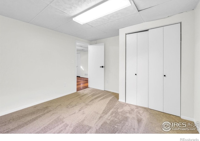 2036 Lexington Ct, Fort Collins, CO 80526 - unfurnished bedroom with carpet floors, a closet, and a paneled ceiling