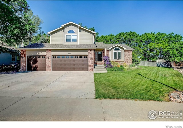 356 Spring Snow Dr, Loveland, CO 80538 - view of front of house with brick siding, concrete driveway, and an attached garage
