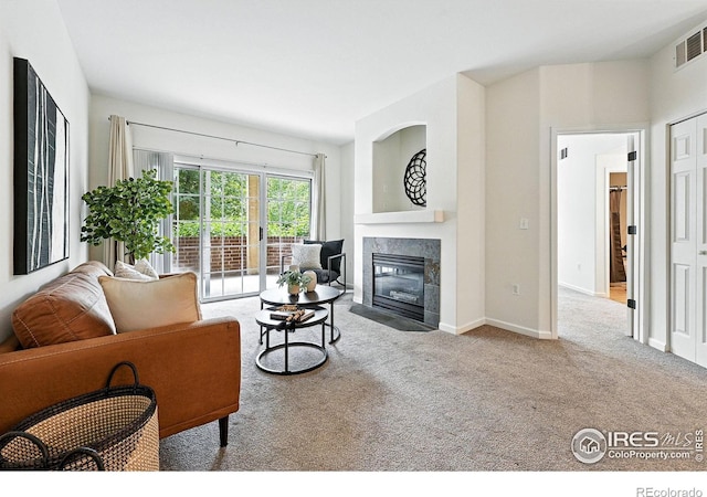 530 Mohawk Dr Unit 73, Boulder, CO 80303 - living room featuring carpet floors and a fireplace
