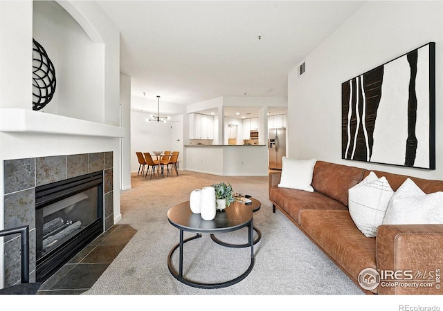 530 Mohawk Dr Unit 73, Boulder, CO 80303 - living area with a tile fireplace and carpet floors