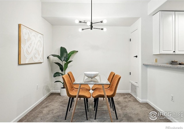 530 Mohawk Dr Unit 73, Boulder, CO 80303 - carpeted dining room featuring a chandelier and baseboards