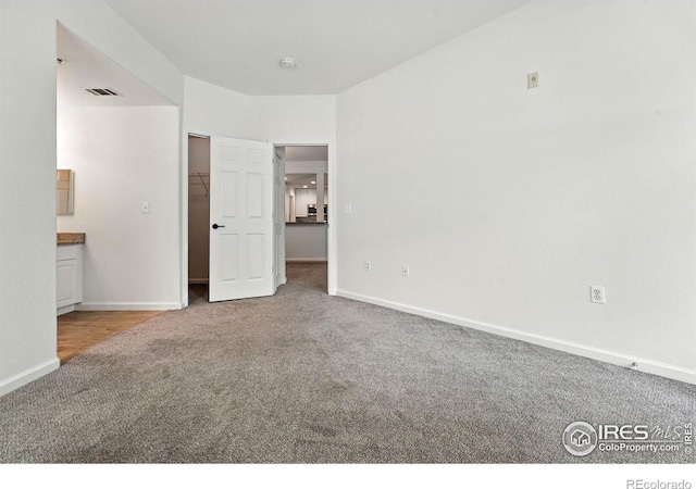 530 Mohawk Dr Unit 73, Boulder, CO 80303 - unfurnished bedroom with carpet flooring, a spacious closet, and connected bathroom