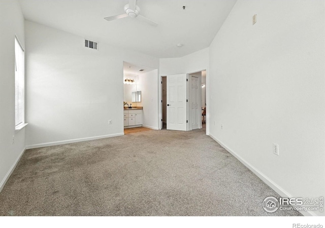 530 Mohawk Dr Unit 73, Boulder, CO 80303 - unfurnished bedroom featuring light colored carpet, ensuite bathroom, and ceiling fan