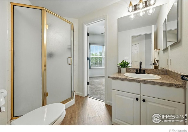 530 Mohawk Dr Unit 73, Boulder, CO 80303 - bathroom with wood-type flooring, vanity, and a stall shower