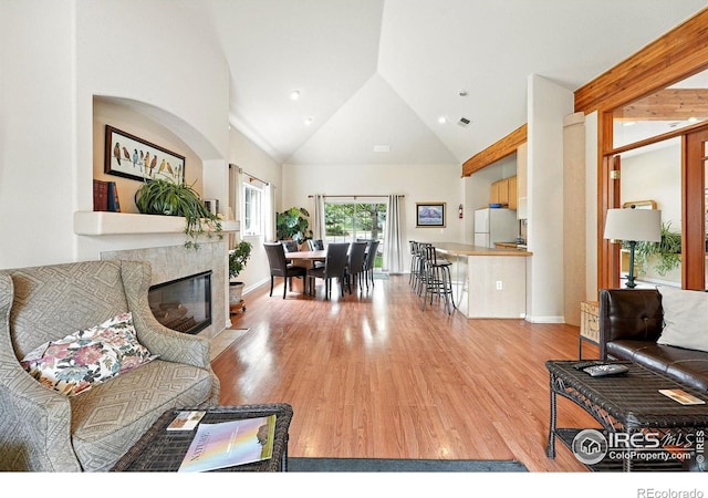 530 Mohawk Dr Unit 73, Boulder, CO 80303 - living area with wood finished floors, high vaulted ceiling, and a fireplace with flush hearth