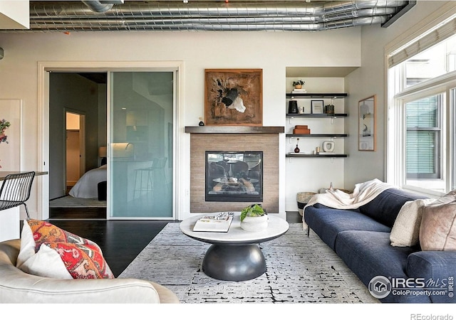 3401 Arapahoe Ave Unit 420, Boulder, CO 80303 - living room with wood finished floors and a glass covered fireplace