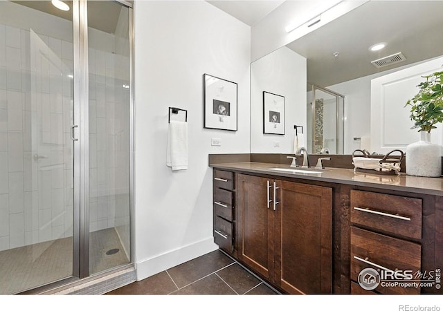 3401 Arapahoe Ave Unit 420, Boulder, CO 80303 - bathroom featuring tile patterned floors, vanity, and a stall shower