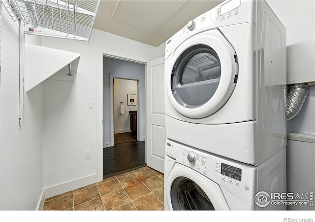 3401 Arapahoe Ave Unit 420, Boulder, CO 80303 - laundry room with stacked washer / dryer and stone finish flooring