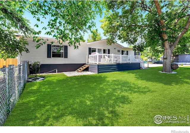 2036 1st Ave Unit 437, Greeley, CO 80631 - back of house featuring a fenced backyard and a deck