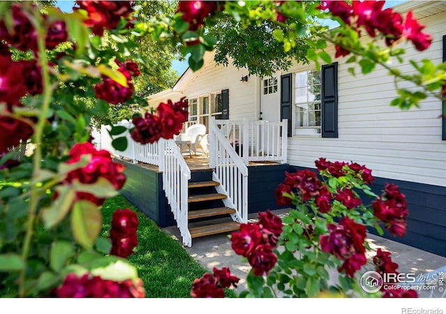 2036 1st Ave Unit 437, Greeley, CO 80631 - view of exterior entry featuring a deck