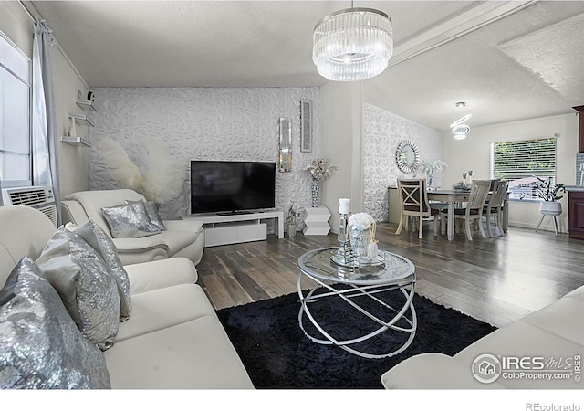 2036 1st Ave Unit 437, Greeley, CO 80631 - living room featuring wood finished floors, a chandelier, and a textured ceiling