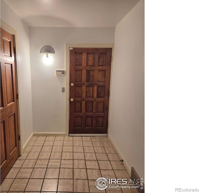 1550 W 28th St Unit 1, Loveland, CO 80538 - foyer with baseboards