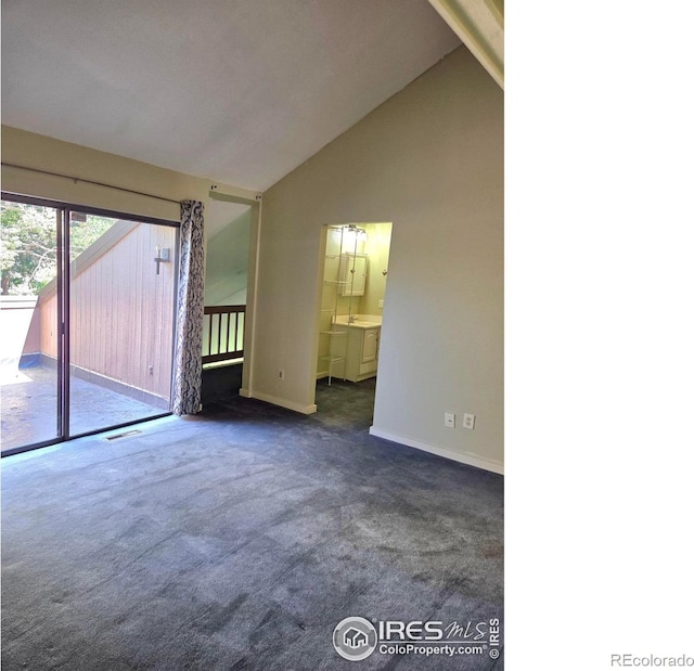 1550 W 28th St Unit 1, Loveland, CO 80538 - carpeted empty room with high vaulted ceiling and baseboards
