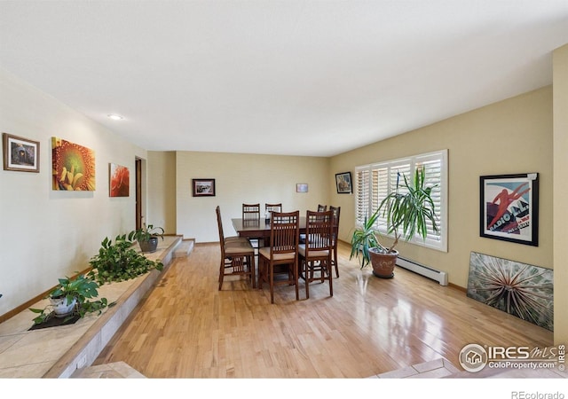 2513 Lanyon Dr, Longmont, CO 80503 - dining area with light wood-style floors and baseboard heating