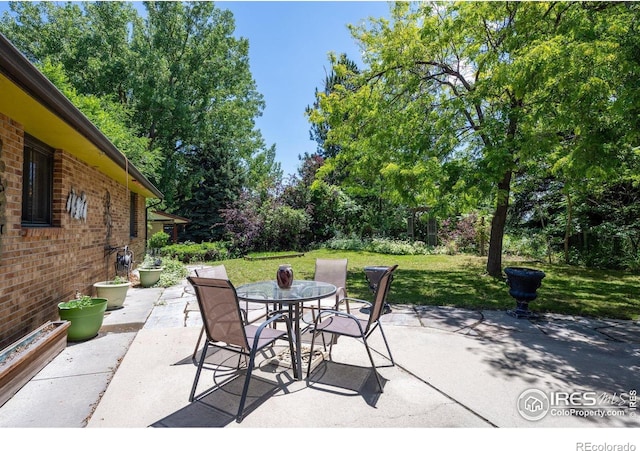 2513 Lanyon Dr, Longmont, CO 80503 - view of patio / terrace with outdoor dining area