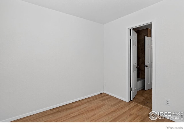 3535 28th St # 202, Boulder, CO 80301 - empty room featuring light wood finished floors and baseboards