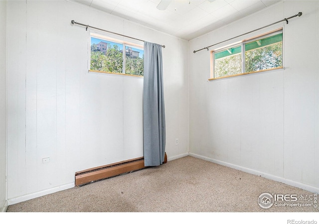 5017 Overhill Dr, Fort Collins, CO 80526 - spare room with a baseboard heating unit and carpet