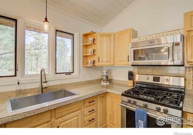 30795 W Ridge Rd, Buena Vista, CO 81211 - kitchen featuring appliances with stainless steel finishes, light brown cabinets, lofted ceiling, plenty of natural light, and decorative light fixtures