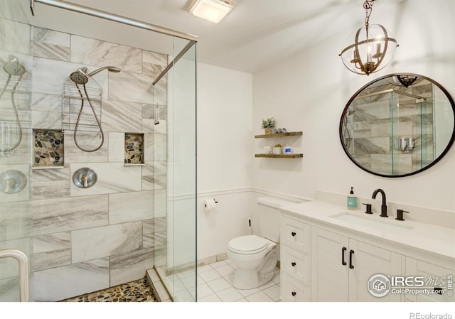 30795 W Ridge Rd, Buena Vista, CO 81211 - bathroom featuring a shower stall, vanity, tile patterned flooring, and a chandelier