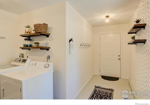 30795 W Ridge Rd, Buena Vista, CO 81211 - laundry room with washer and clothes dryer, a textured ceiling, and wallpapered walls