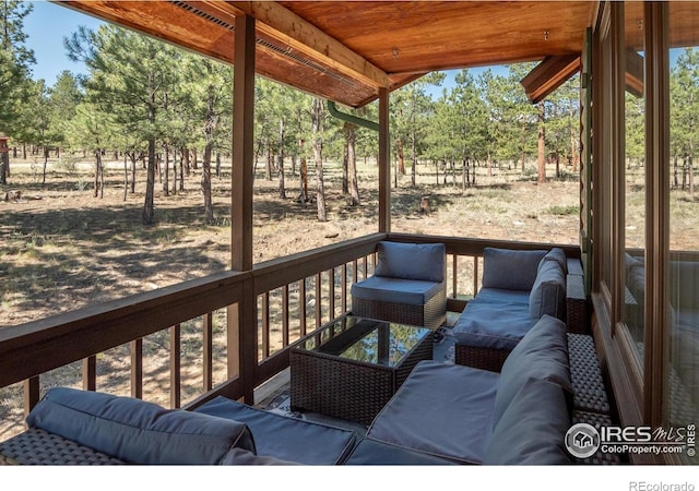 30795 W Ridge Rd, Buena Vista, CO 81211 - deck featuring an outdoor hangout area and view of scattered trees