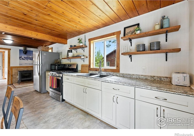 181 County Road 874, Tabernash, CO 80478 - kitchen with open shelves, appliances with stainless steel finishes, wooden ceiling, white cabinetry, and light stone counters