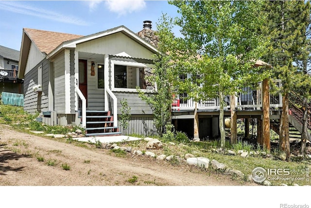181 County Road 874, Tabernash, CO 80478 - view of front of property with stairs, a deck, and a chimney