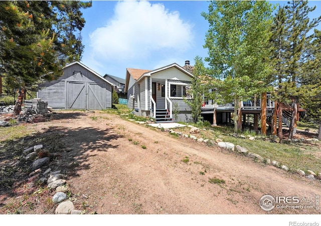 181 County Road 874, Tabernash, CO 80478 - view of front of home with a barn, driveway, an outbuilding, and stairs