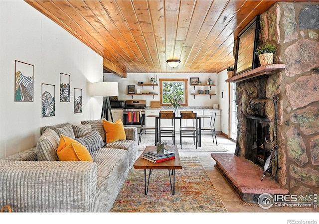181 County Road 874, Tabernash, CO 80478 - living area featuring wood ceiling and a stone fireplace
