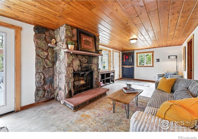 181 County Road 874, Tabernash, CO 80478 - living area with wooden ceiling, plenty of natural light, a fireplace, and light tile patterned flooring