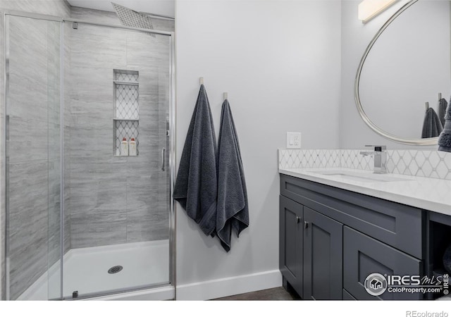 37 Wagner Cir, Boulder, CO 80304 - bathroom with vanity, backsplash, and a stall shower
