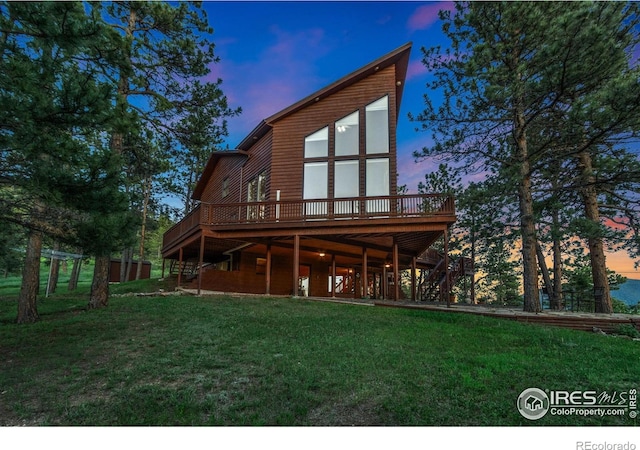 451 Newell Dr, Loveland, CO 80537 - back of house with a deck and a lawn