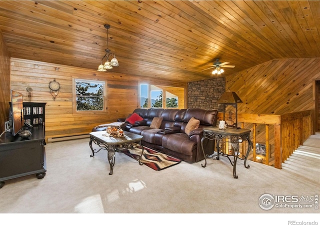 451 Newell Dr, Loveland, CO 80537 - carpeted living room featuring wood walls, vaulted ceiling, ceiling fan, wooden ceiling, and a baseboard radiator