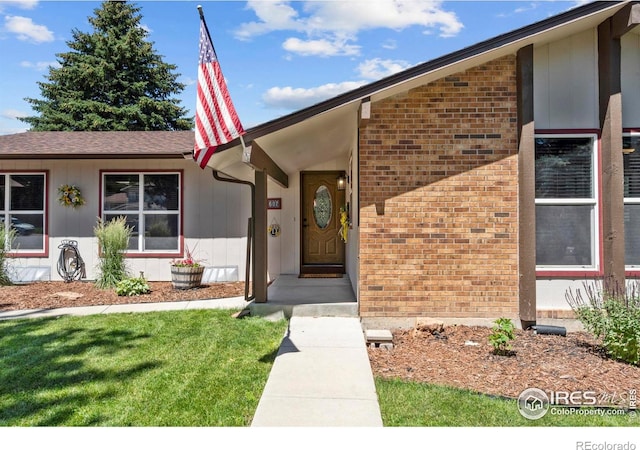 607 42nd Ave, Greeley, CO 80634 - doorway to property with brick siding and a yard