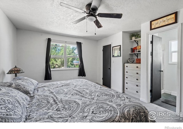607 42nd Ave, Greeley, CO 80634 - carpeted bedroom with a textured ceiling and ceiling fan