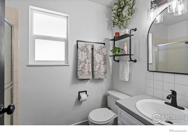 607 42nd Ave, Greeley, CO 80634 - full bathroom with vanity, decorative backsplash, and an enclosed shower