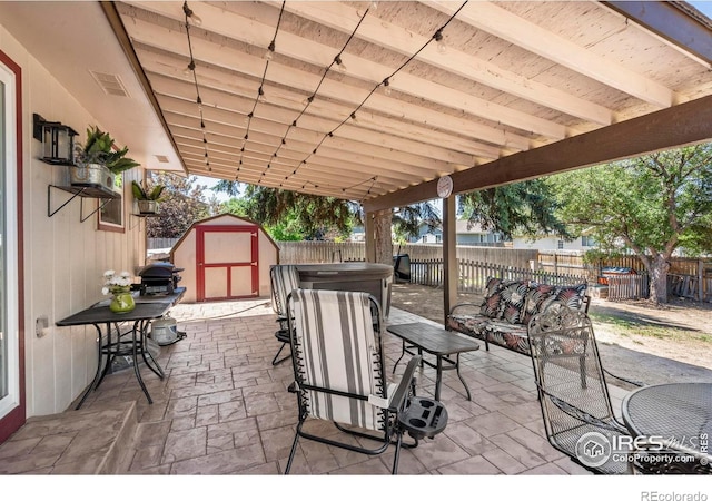 607 42nd Ave, Greeley, CO 80634 - fenced backyard featuring a storage unit, a patio, and an outdoor living space