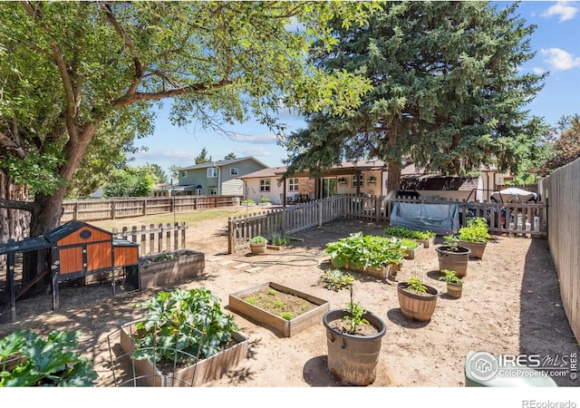 607 42nd Ave, Greeley, CO 80634 - fenced backyard featuring a vegetable garden