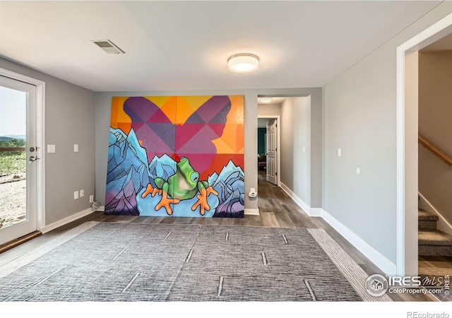 4815 Sugarloaf Rd, Boulder, CO 80302 - spare room featuring stairs and wood finished floors