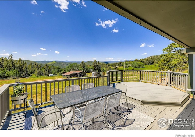 4815 Sugarloaf Rd, Boulder, CO 80302 - deck featuring a mountain view, outdoor dining space, and a yard