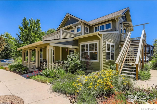 193 2nd Ave Unit A, Lyons, CO 80540 - view of front facade with stairway, covered porch, and a balcony