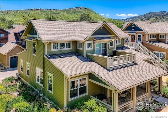 193 2nd Ave Unit A, Lyons, CO 80540 - rear view of house featuring roof with shingles, a mountain view, and a balcony